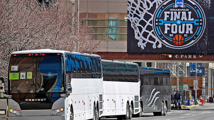 Buses line up to transport teams during the men's NCAA tournament